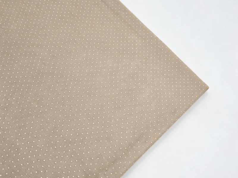Fabric-wrapped metal cover with fold