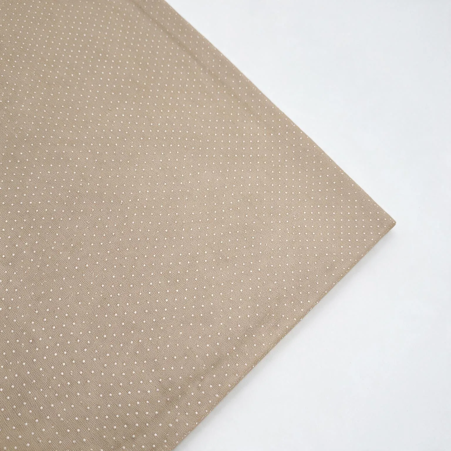 Fabric-wrapped metal cover with fold